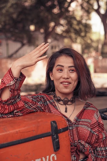 Woman Raising Right Hand