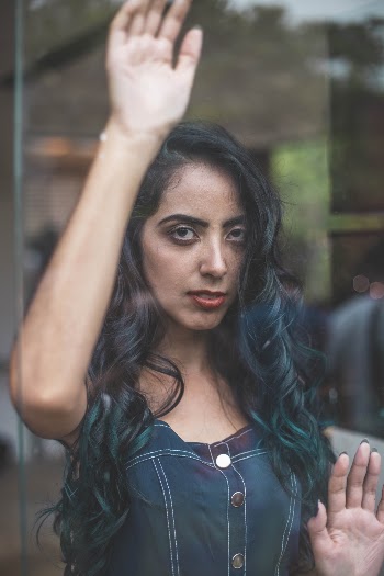 Woman Raising Right Hand Close-up Photography