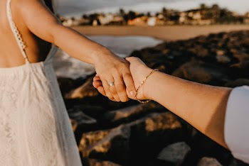 Woman Reaching Hand of Another Person