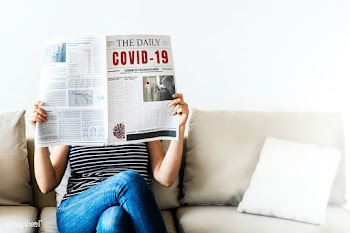 Woman reading coronavirus news from a newspaper | Free  photo - 2306889