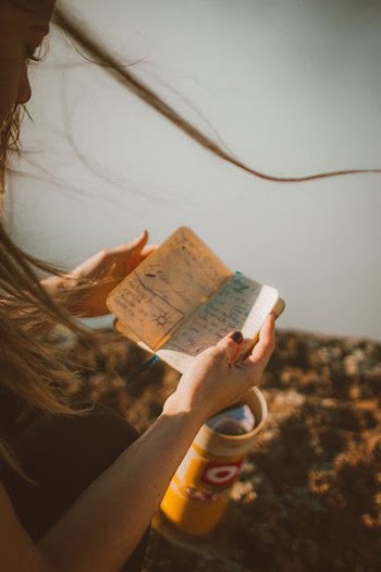woman reading notebook