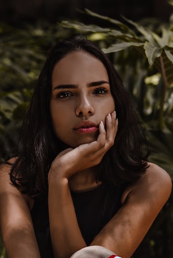 Woman Resting Her Chin on Hand