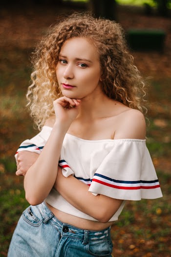 Woman Resting Her Chin on Her Right Hand