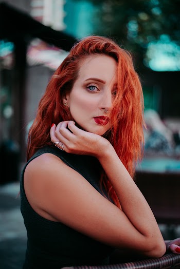 Woman Resting Her Chin on Right Hand