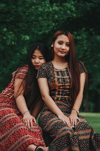 Woman Resting Her Head on Another Women's Shoulder