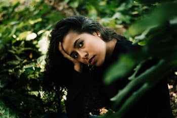 Woman Resting Her Head With Her Right Hand