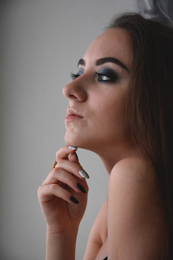 Woman Resting Right Hand on Chin