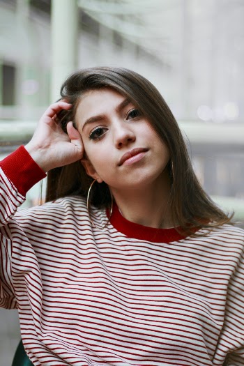 Woman Resting Right Hand on Head