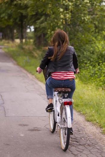 Woman Riding Bicycle