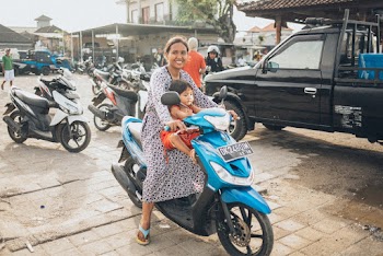 Woman Riding Motor Scooter