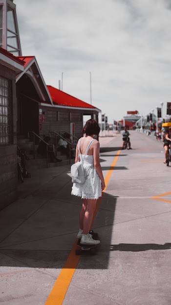 Woman Riding Skateboard