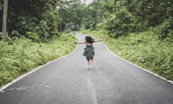 Woman Running on Road