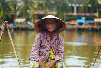 Woman Sailing on Brown Boat