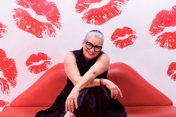 Woman Sat On Red Lip Couch