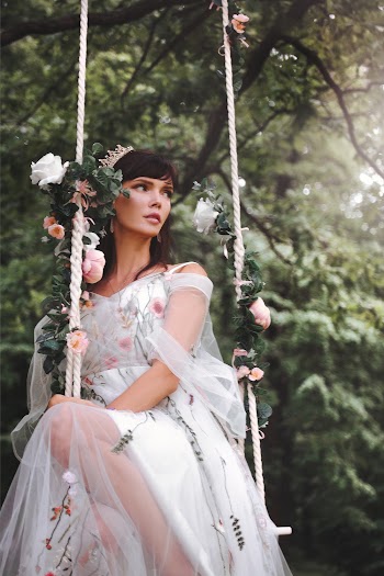 Woman Seated on Swing