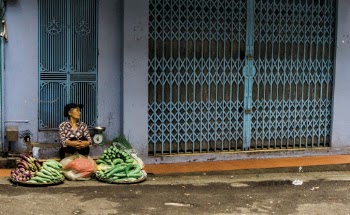 Woman Selling Vegetables on Street