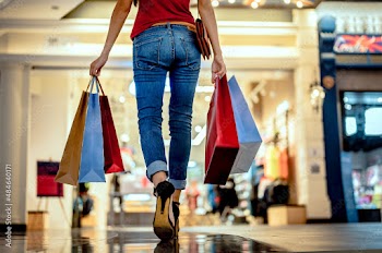 Woman shopper spent money and times in shopping mall with happy time, walking enjoy time in shopping mall purchasing consumerist goods and clothing under situation of COVID19 infection