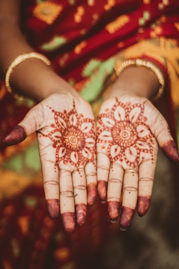Woman Showing Henna Tattoo on Her Hands