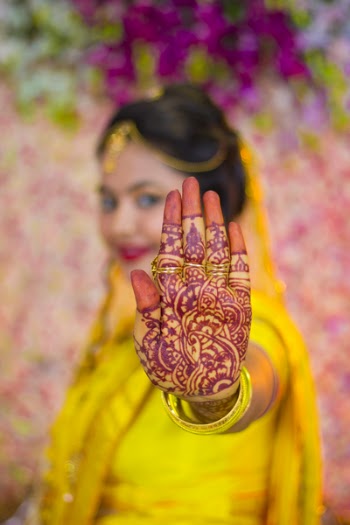 Woman Showing Mehndi Tattoo