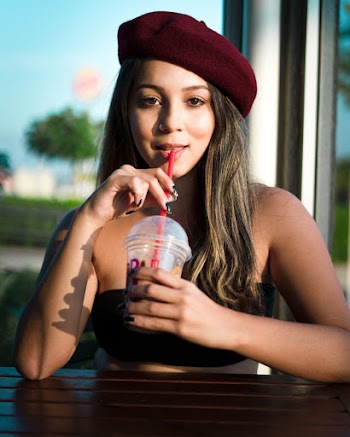 Woman Sipping From Cup