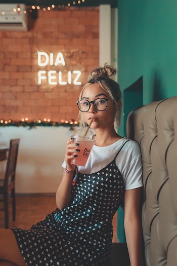 Woman Sipping from Cup