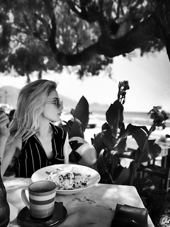 Woman Sit Next to Table