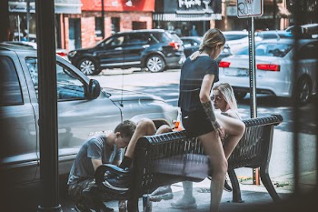 Woman Siting on Bench Near on Man
