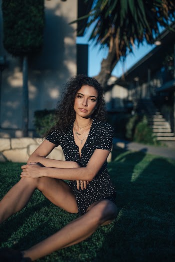 Woman Siting on Grass Field