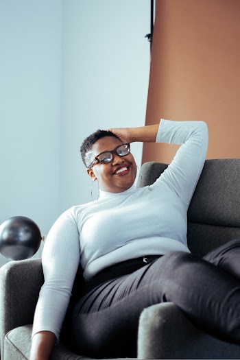Woman Siting on Sofa Chair