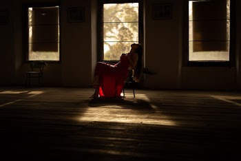 Woman Sits on Chair