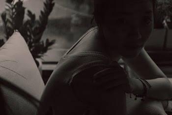 Woman Sitting and Looking Her Right Side