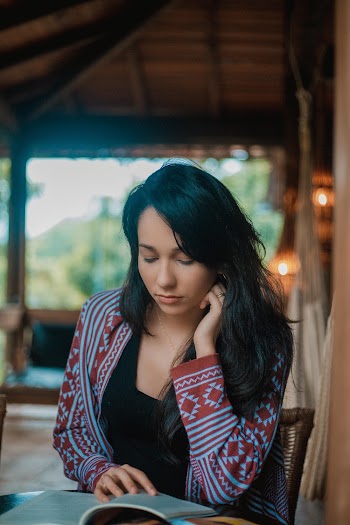 Woman Sitting And Reading A Book 