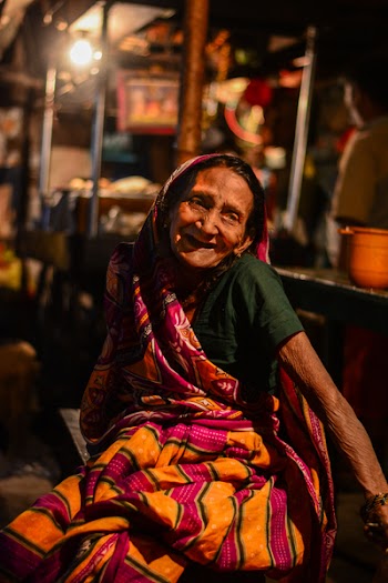 Woman Sitting and Smiling for Photo