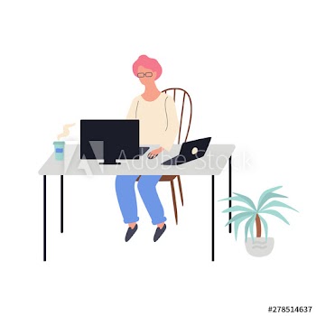Woman sitting at the desk and working on computer