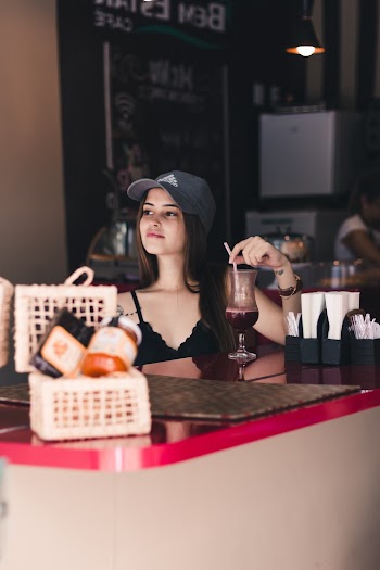 Woman Sitting at the Table