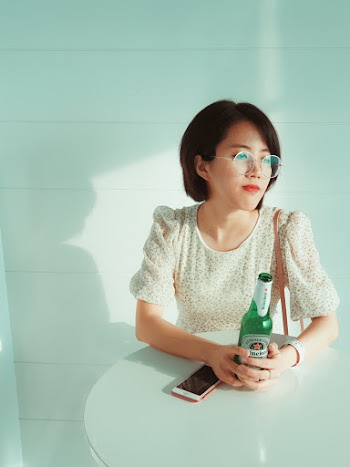 Woman Sitting at the Table