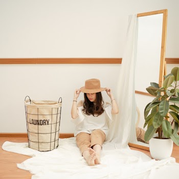 Woman Sitting Beside A Mirror