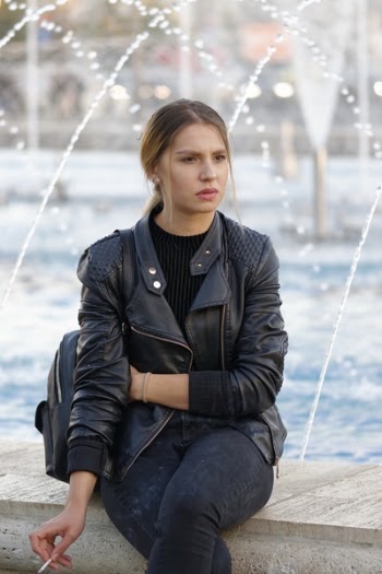 Woman Sitting Beside Fountain