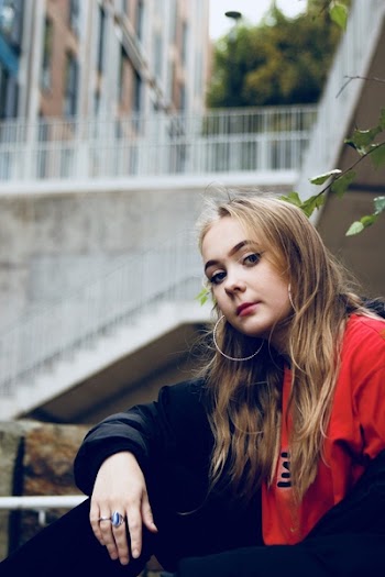 Woman Sitting Beside Green Plant
