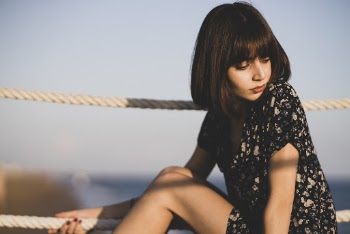 Woman Sitting Beside Ropes