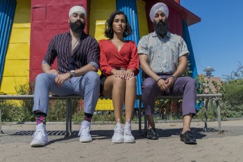 Woman Sitting Beside Two Men