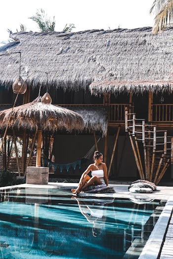 Woman Sitting By The Pool