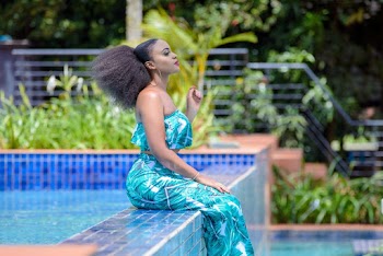 Woman Sitting By The Pool