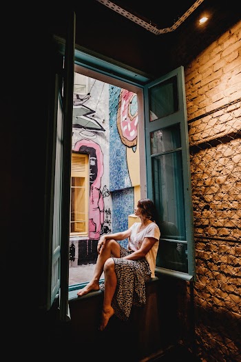 Woman Sitting by the Window