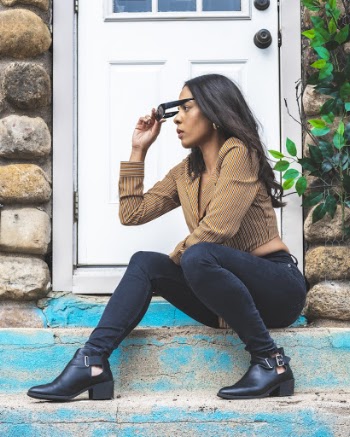 Woman Sitting Door On A Door Step