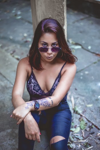 Woman Sitting Down While Posing
