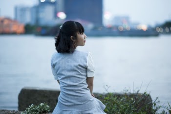 Woman Sitting Front of Ocean