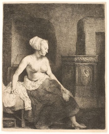 Woman sitting half dressed beside a stove | Free Photo - rawpixel
