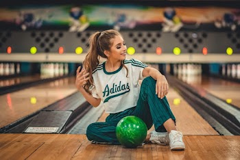 Woman Sitting in A Bowling Alley