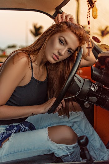 Woman Sitting in a Car